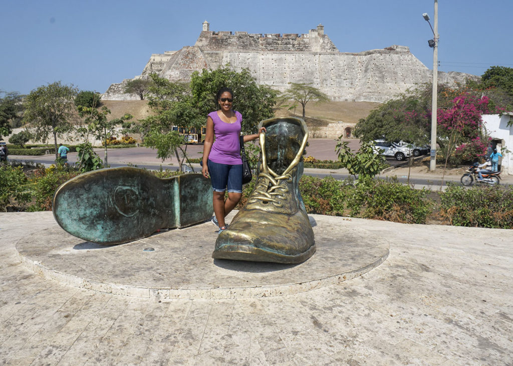 posing for travel photos on a solo trip to Cartagena